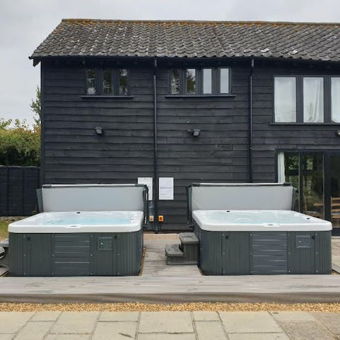 Relax, unwind and indulge in a soak in the twin hot tubs