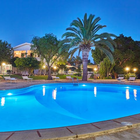 Take a dip in the palm-lined pool