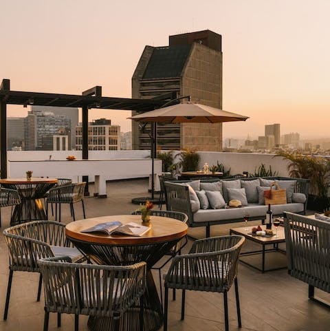 Head up to the communal rooftop at sunset and drink in the view