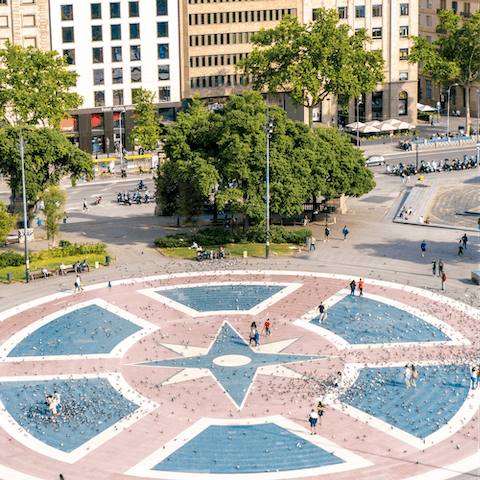 Stroll over to the bustling Plaça de Catalunya, just two minutes from your building
