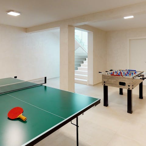 Take on a table tennis or table football match down in the games room