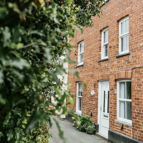Stay in a cosy red-brick cottage steeped with traditional character