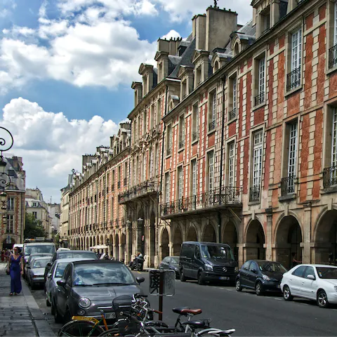 Visit the beautiful Place des Vosges