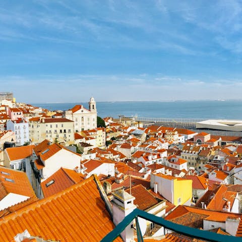 Gaze out to magnificent views of the Tagus River from your balconette