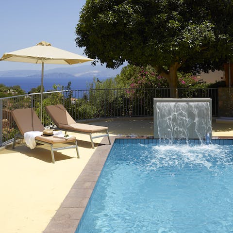 Take a siesta by your private pool, complete with waterfall 