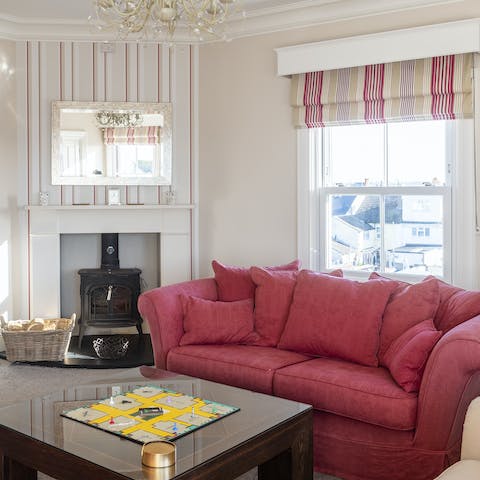 Unwind in the the cosy living room over a board game in front of the log burner fire 