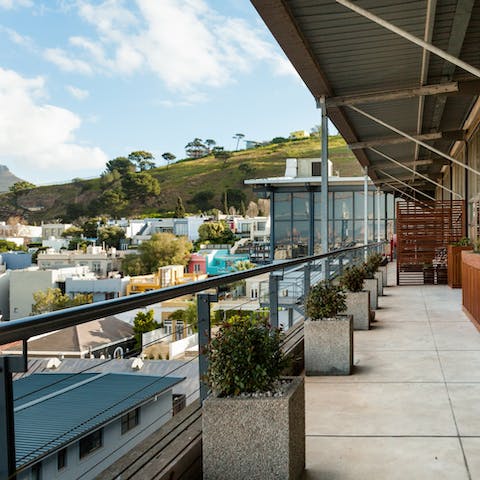 Sip on sundowners on your roomy balcony while you gaze out over the city