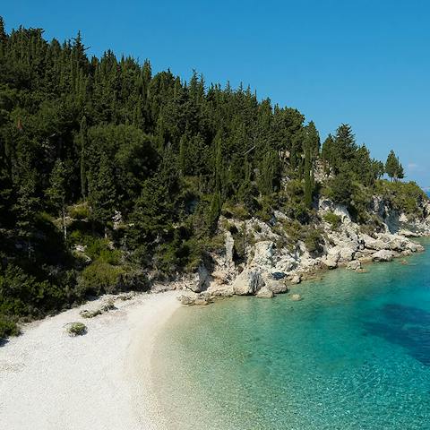 Take the short stroll to Monodendri beach and let the turquoise sea wash over your feet