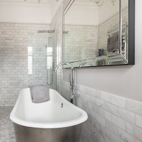 Soak your muscles in the freestanding tub after a long day exploring the city