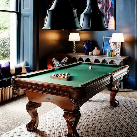 Enjoy a game of pool with a glass of Scotch in the billiard room