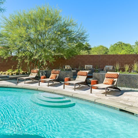 Sunbathe in style by the luxurious pool