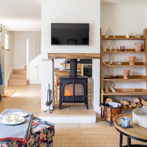 Throw another log on the wood-burning stove and snuggle up under a blanket in the sitting room