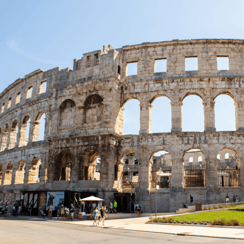 Drive to the historic city of Pula, home to a well-preserved Roman amphitheatre