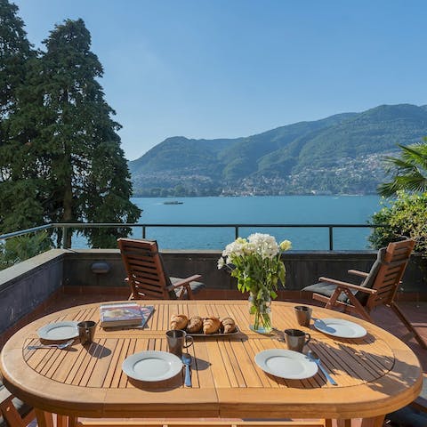 Start your day with breakfast and Italian coffee on your private lake-facing terrace 
