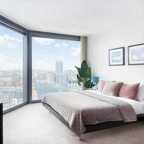 Wake up to skyscraper views over the city from your bedroom