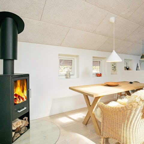 Get cosy the Danish way and wrap yourself up in a thick blanket by the log burner