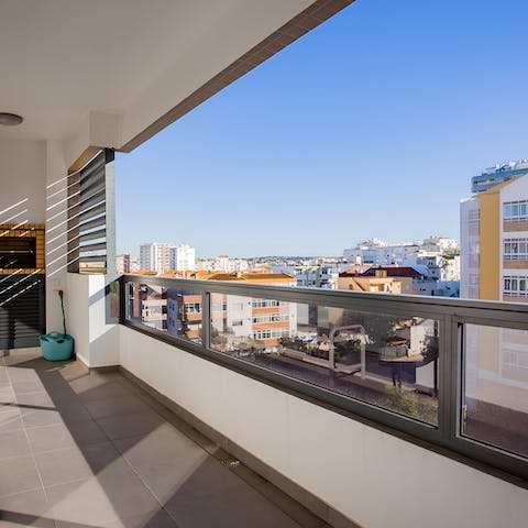 Gaze out at views over the city from the private balcony
