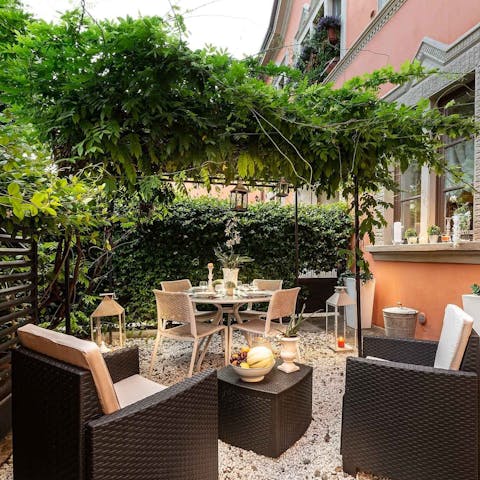 Enjoy a glass of Tuscan wine in the leafy garden