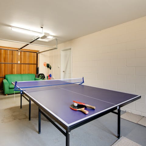 Get competitive over a round of ping pong in the games room