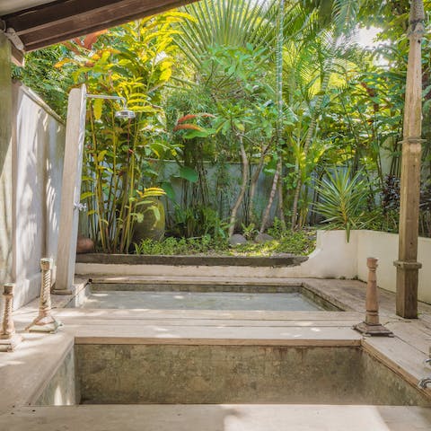 Bathe or shower in the water with a tropical background