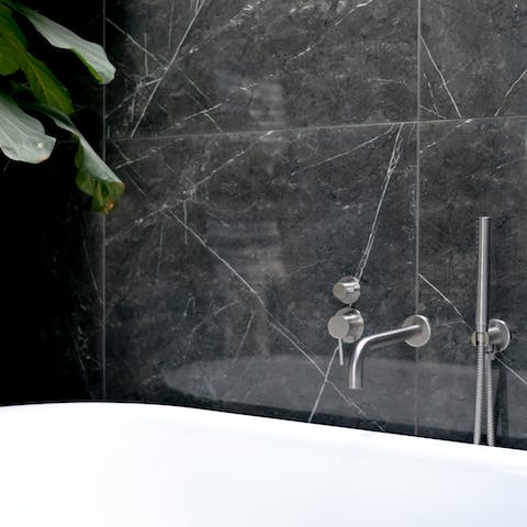 Luxuriate in stylish bathrooms, with one bath under a skylight
