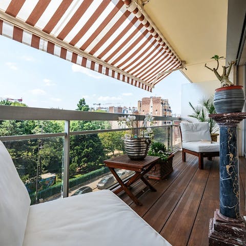 Sip your morning coffee on the balcony overlooking the leafy streets below