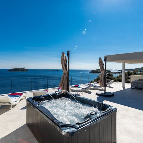 Catch some rays while relaxing in the terrace's hot tub