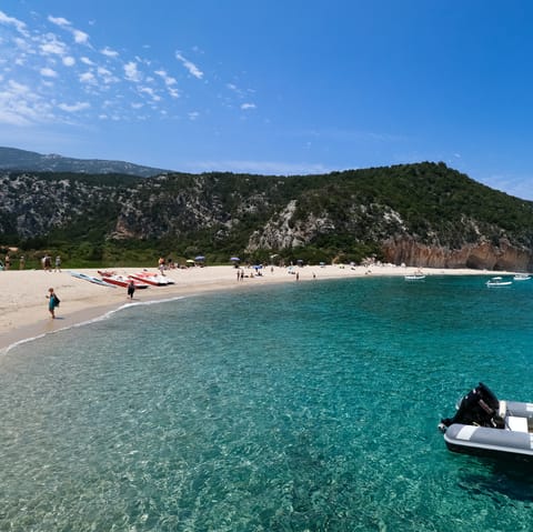 Make the short drive down to Cala Olivera and spend the day in surf and sand