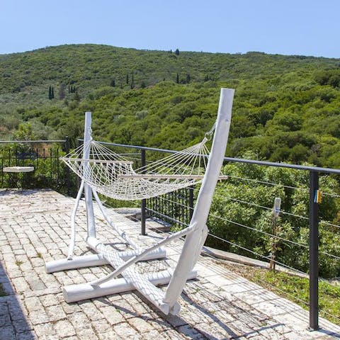 Get lost in a good book while swinging gently in the hammock, overlooking the luscious hillscape