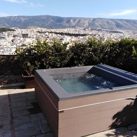 Unwind in the hot tub and gaze across Athens and beyond