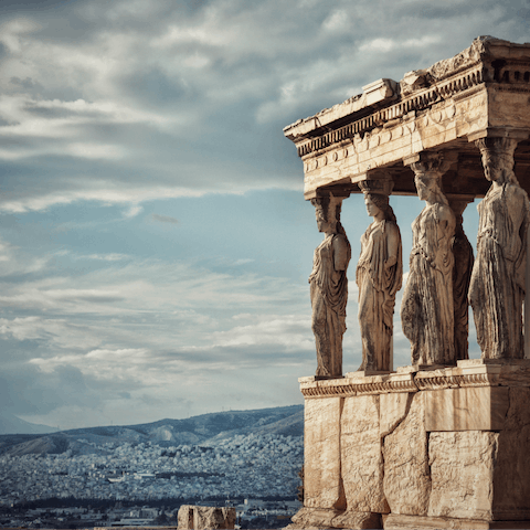 Visit the mighty Acropolis, less than a ten-minute walk from your doorstep