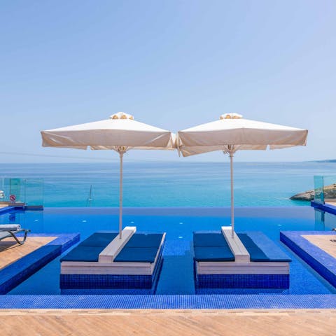 Lounge by the pool or swim a few lengths overlooking the Ionian Sea