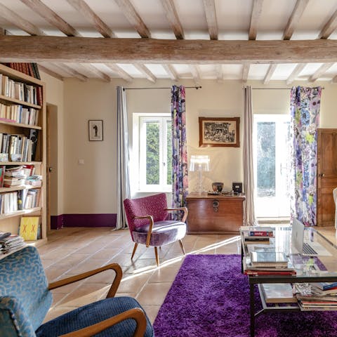 Well-stocked bookshelves and a mishmash of colours make the rooms feel homely and inviting