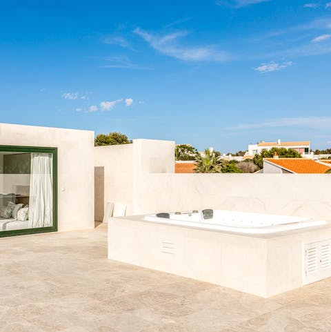Soak up the sun in the rooftop hot tub