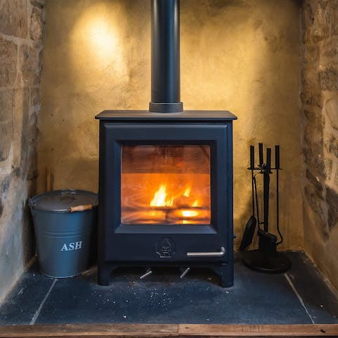 Light the wood-burning stove to revive the old cottage feel