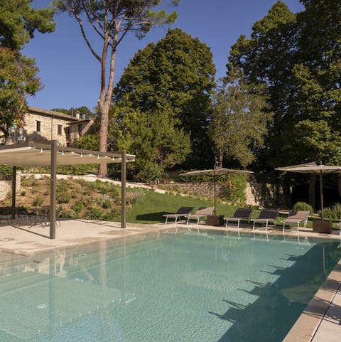 Bag a poolside lounger and snooze in the shade of a parasol