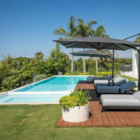 Enjoy the feeling of total relaxation while lounging by the pool