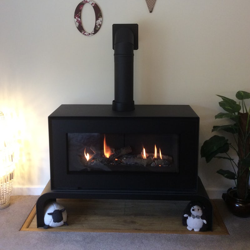 Open a bottle of wine and get cosy by the fireplace
