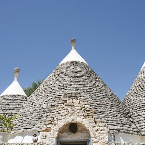 Admire the traditional conical roofs