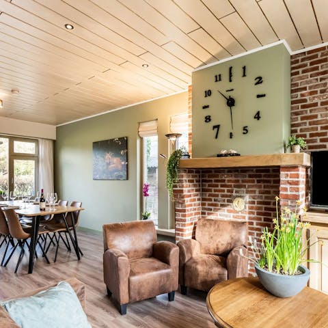 Relax in the bright living room  with views of the garden