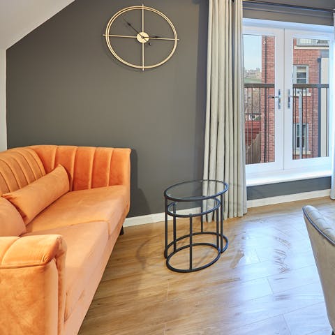 Find a cosy corner to enjoy a good book on the velvet sofa