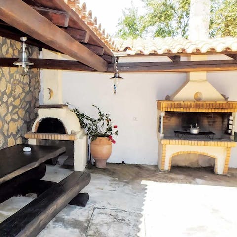 Dine and cook al fresco with the BBQ and pizza oven
