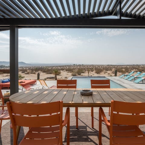 Eat outside on the covered terrace, with far reaching views across the desert