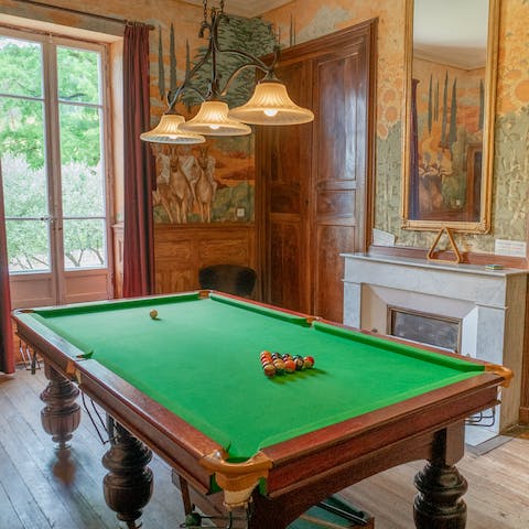 Challenge your friends to a game of pool in the billiards room