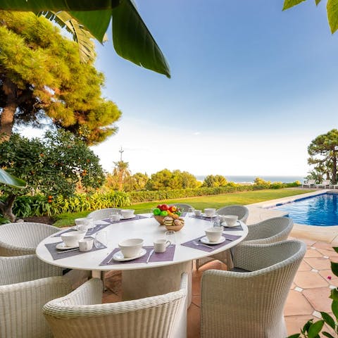 Dine outdoors overlooking the crystal-clear sea