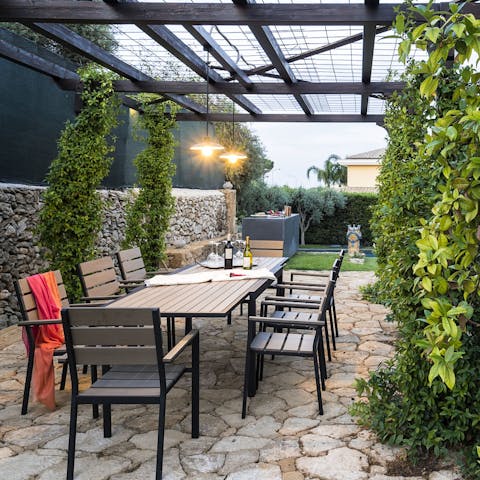Gather round the outdoor dining table for relaxed dinners at home