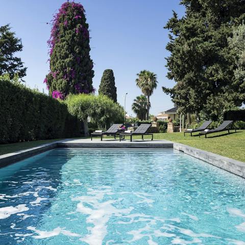 Sunbathe in your lush surroundings before take a dip in the heated pool