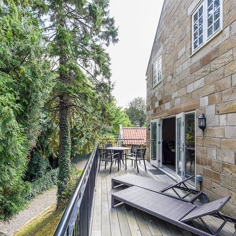 Lay out on the deck and admire the woods 