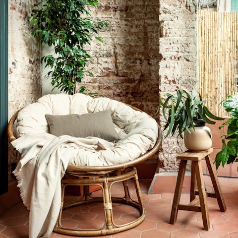 Catch some Spanish rays on the terrace's Papasan chair