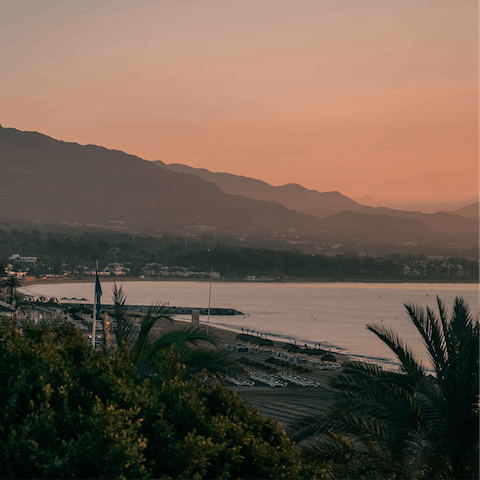 Take a sunset walk along Playa del Cable, only a short drive away
